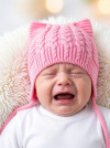 Вязаная однослойная шапочка с завязками фото 6 &mdash; MamaEmma.ru