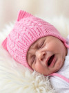 Вязаная однослойная шапочка с завязками фото 5 &mdash; MamaEmma.ru